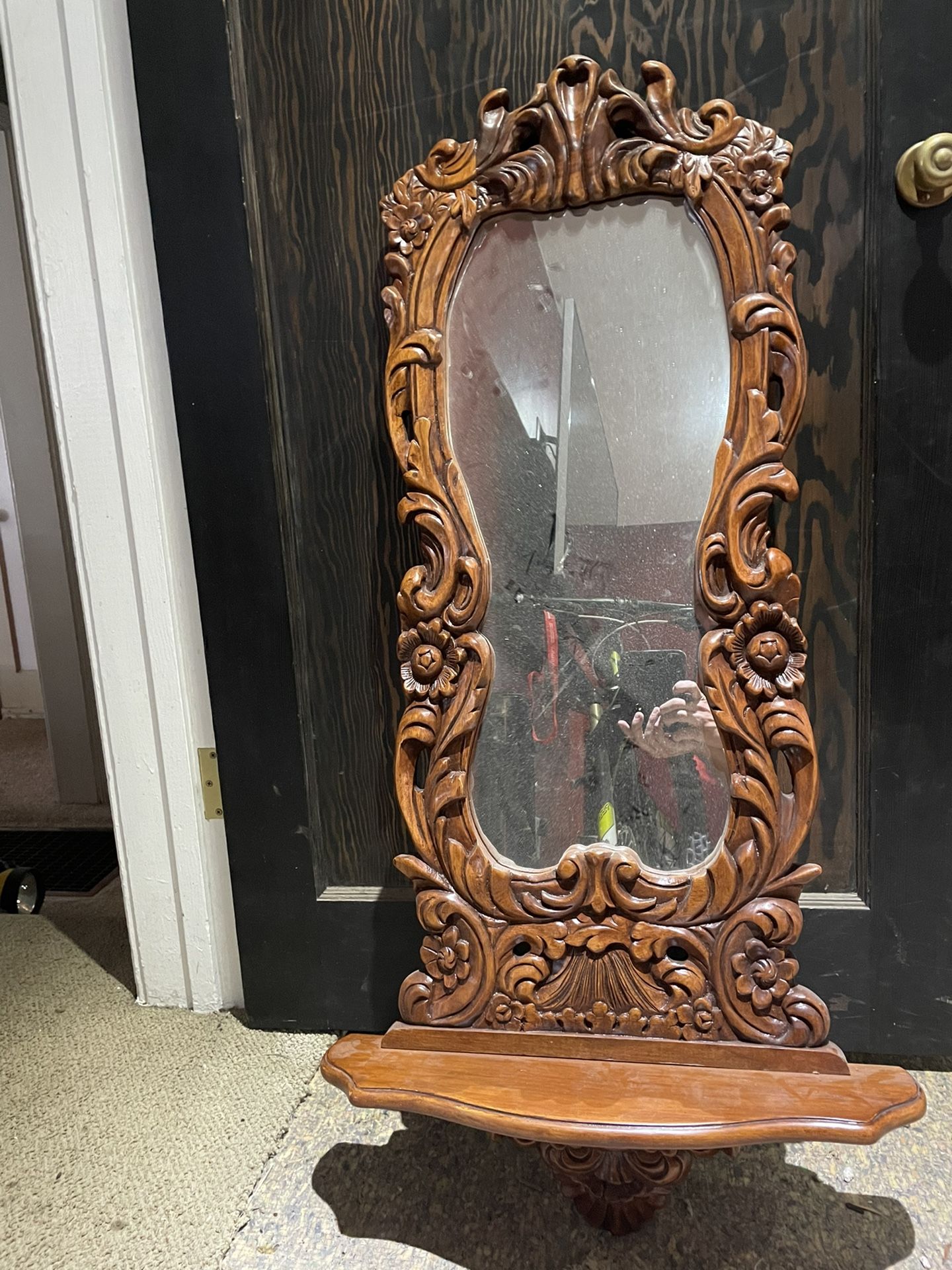 Mirror with shelf.