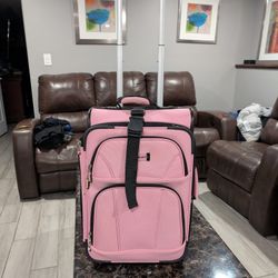 pink Rockland softside upright carry-on suitcase