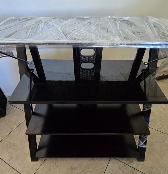 FOUR-TIERED TEMPERED GLASS BLACK AND CHROME TV OR MEDIA STAND.