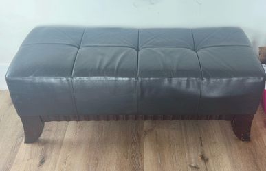 Black, leather and brown wood ottoman