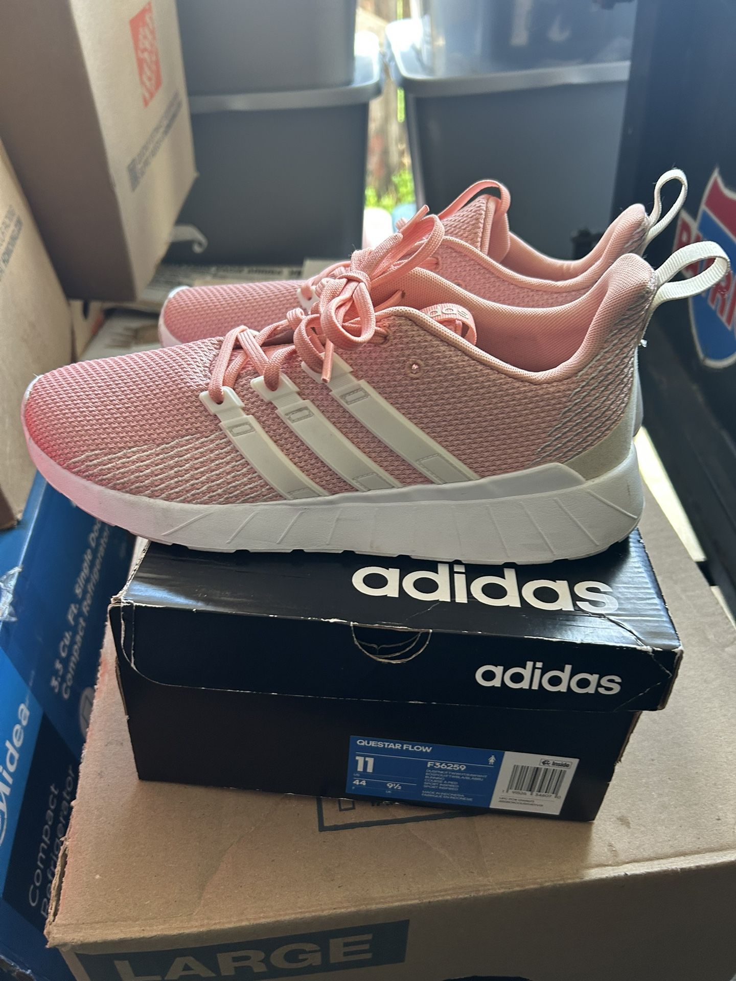 pink Adidas Questar Flow sneakers.