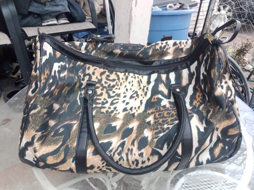 Leopard Bag    In Good Condition It Has Wheels On The Back Rolling