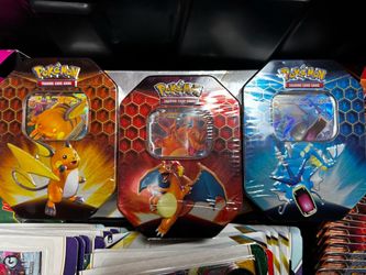 new sealed Pokemon TCG Hidden Fates Charizard, Raichu, and Gyarados Tin Set