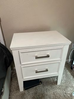 white dresser and nightstand
