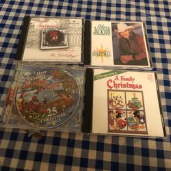 4 Christmas CD’s Including Alan Jackson. $1. Ea. 