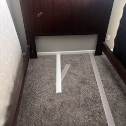 Queen bed with night stand .