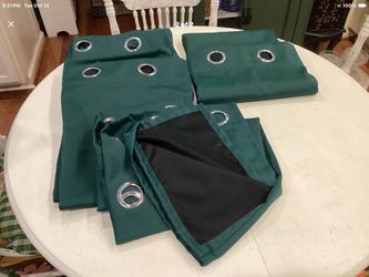 4 Grommet curtain panels ( black out) 100%polyester emerald green  50X84. Like brand new  Bottom panel shows back of panel