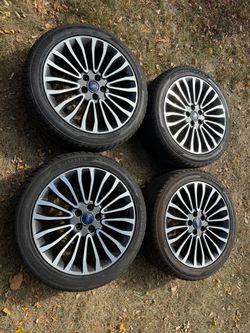 Ford Fusion Titanium wheels and new 235 45 18 all season tires