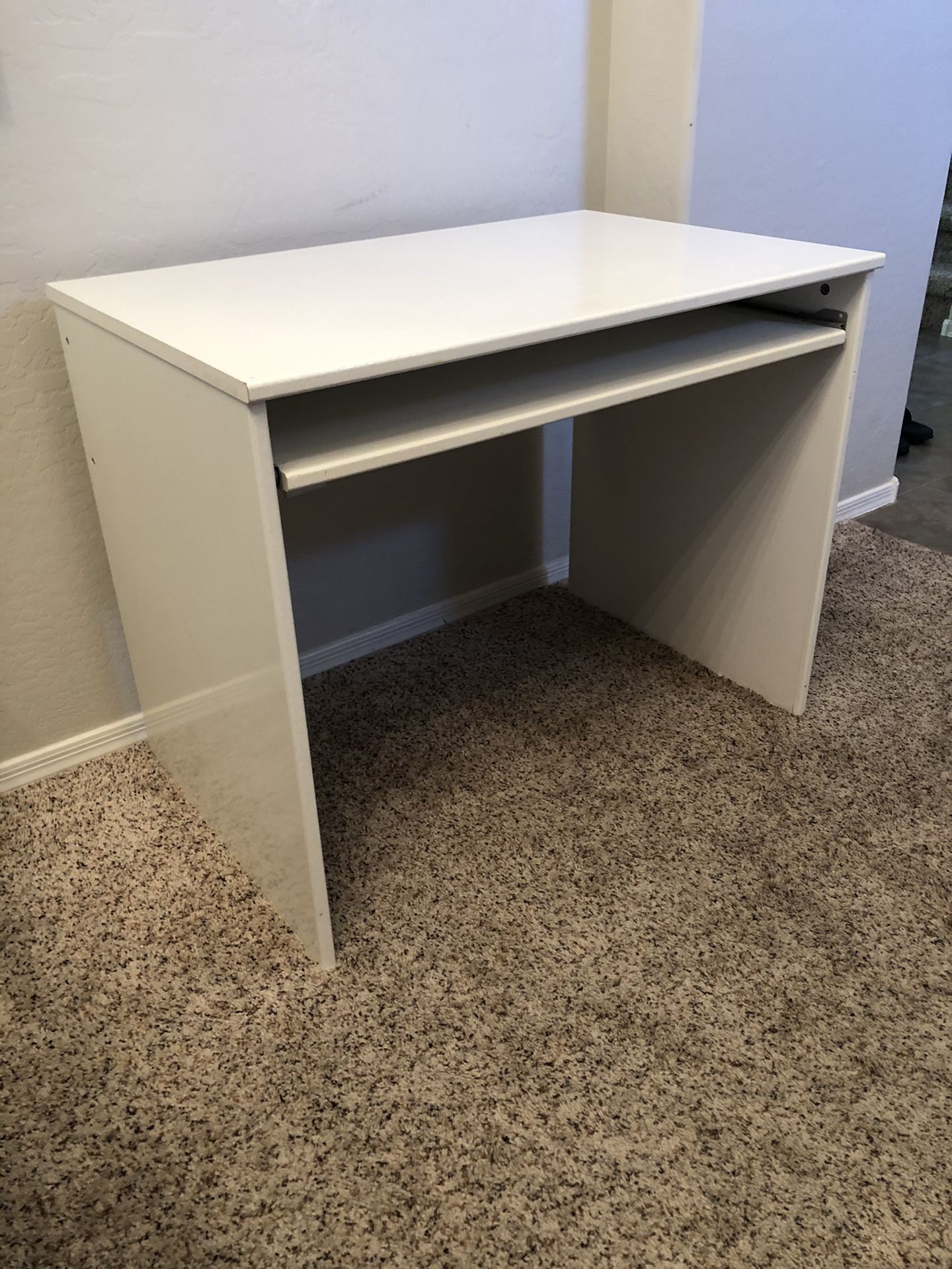 White desk with sliding keyboard tray