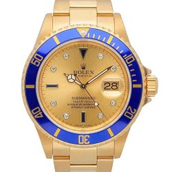 2007 Men's Rolex 40mm Submariner Oyster Perpetual 18K Yellow Gold Watch with Champagne Diamond Dial and Blue Bezel. (Ref# 16618 / 455-78426)
