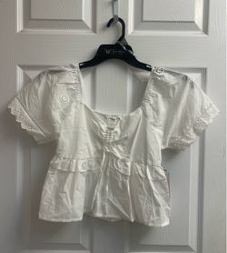 Brand new Juniors white & yellow eyelet peplum tops sizes XS-S-M-L-XL & XXL $6.00 each