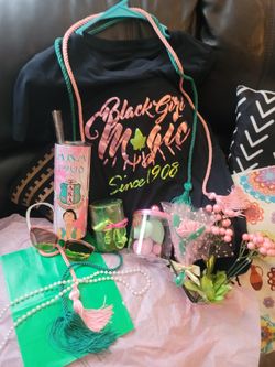 Exquisite AKA Gift Set. New
 AKA Tumbler. Green evegreen scented candle with pink N green ribbon, AKA Signature Est. 1908 tee shirt. Pink sunglasses, 