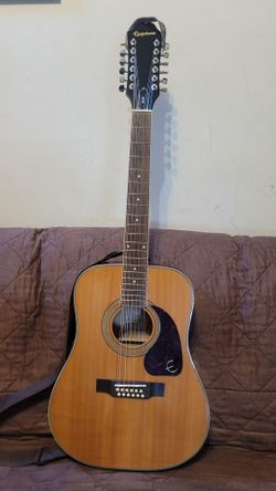 EPIPHONE 12 STRINGS ACOUSTIC GUITAR MODEL DR-212 DREINAUGH IN NATURAL COLOR.