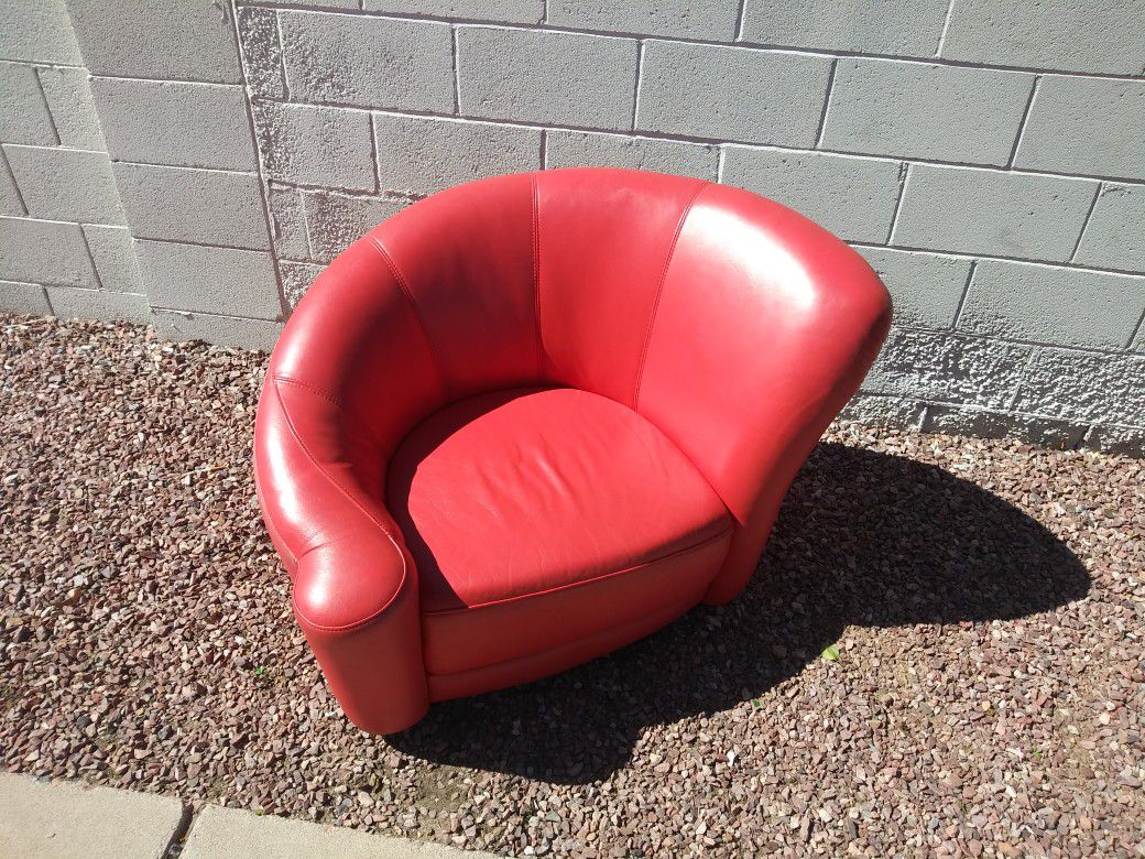 Cushioned chair red orange color.