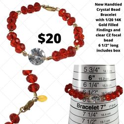 New hand tied Crystal Bead bracelet with gold findings and clear CZ focal bead, 6 1/2” long, with elegant case