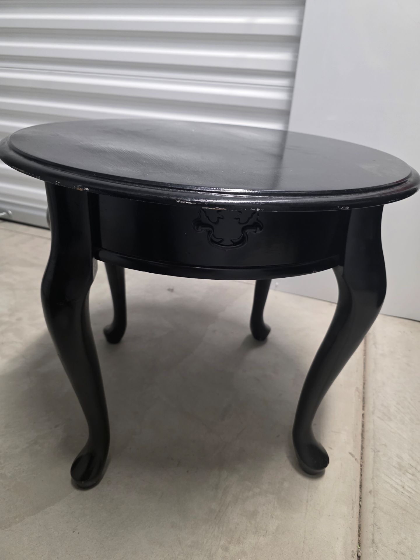 Small round black side table