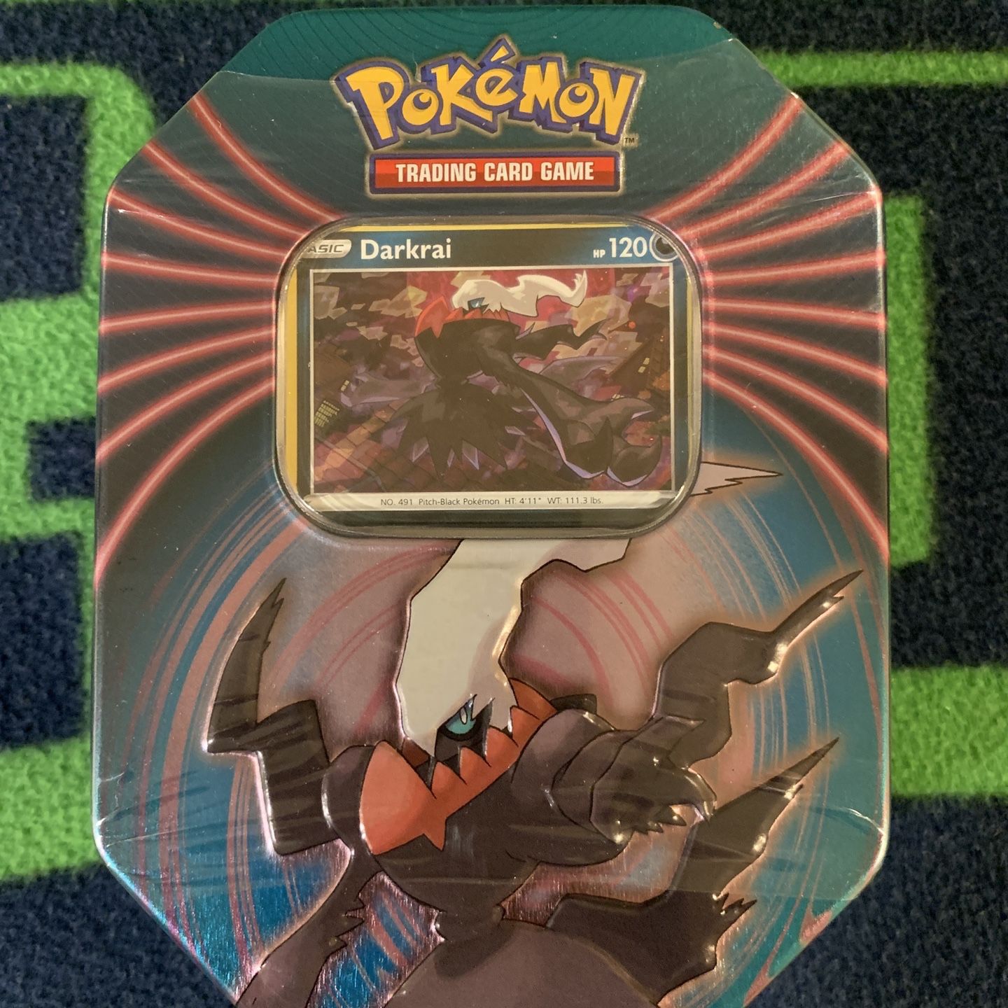 pokemon darkrai tin trading card game Pokmon Triple Whammy A code card for the Pokmon Trading Card Game Online(Each booster pack contains 10 randomly inserted game cards.) Cards vary by pack Darkrai Walgreens Tin Opening (Triple