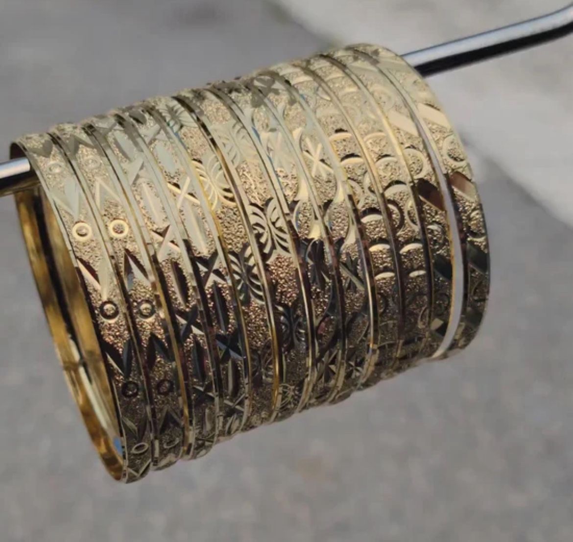 One at 12 bangles Brazilian gold plated