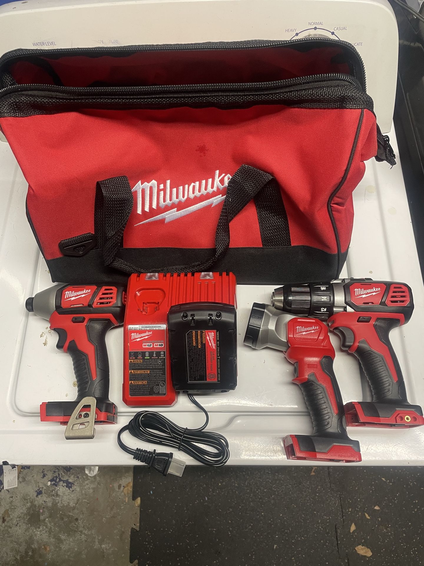 Milwaukee M18 Drill & Impact driver with battery and charger.