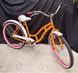 Women's Schwinn Cruiser Bike - Shimano Gears  Women's Schwinn Cruiser Bike 7-speed Shimano gears Vibrant orange & pink matching graphics on frame, bot