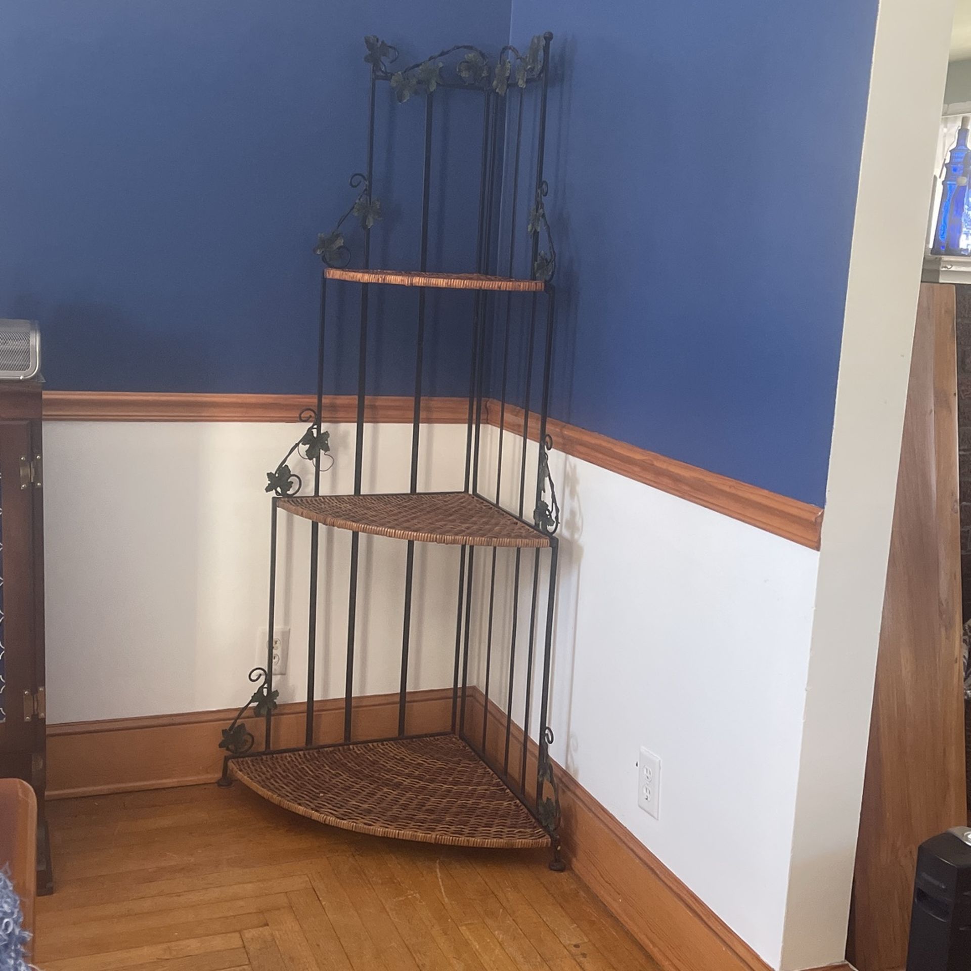 Wrought iron and rattan plant stand