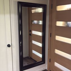 Large wall mounted mirror with a minor flaw