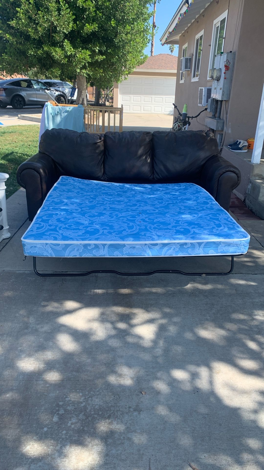 A leather couch, a bed couch