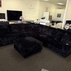 Giant corduroy sectional in black with Cupholders and usb ports