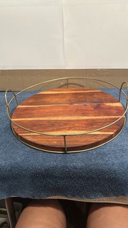 Round Wood Serving Tray with Gold Metal Frame.