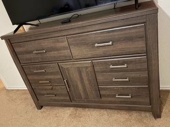 Brown dresser with mirror