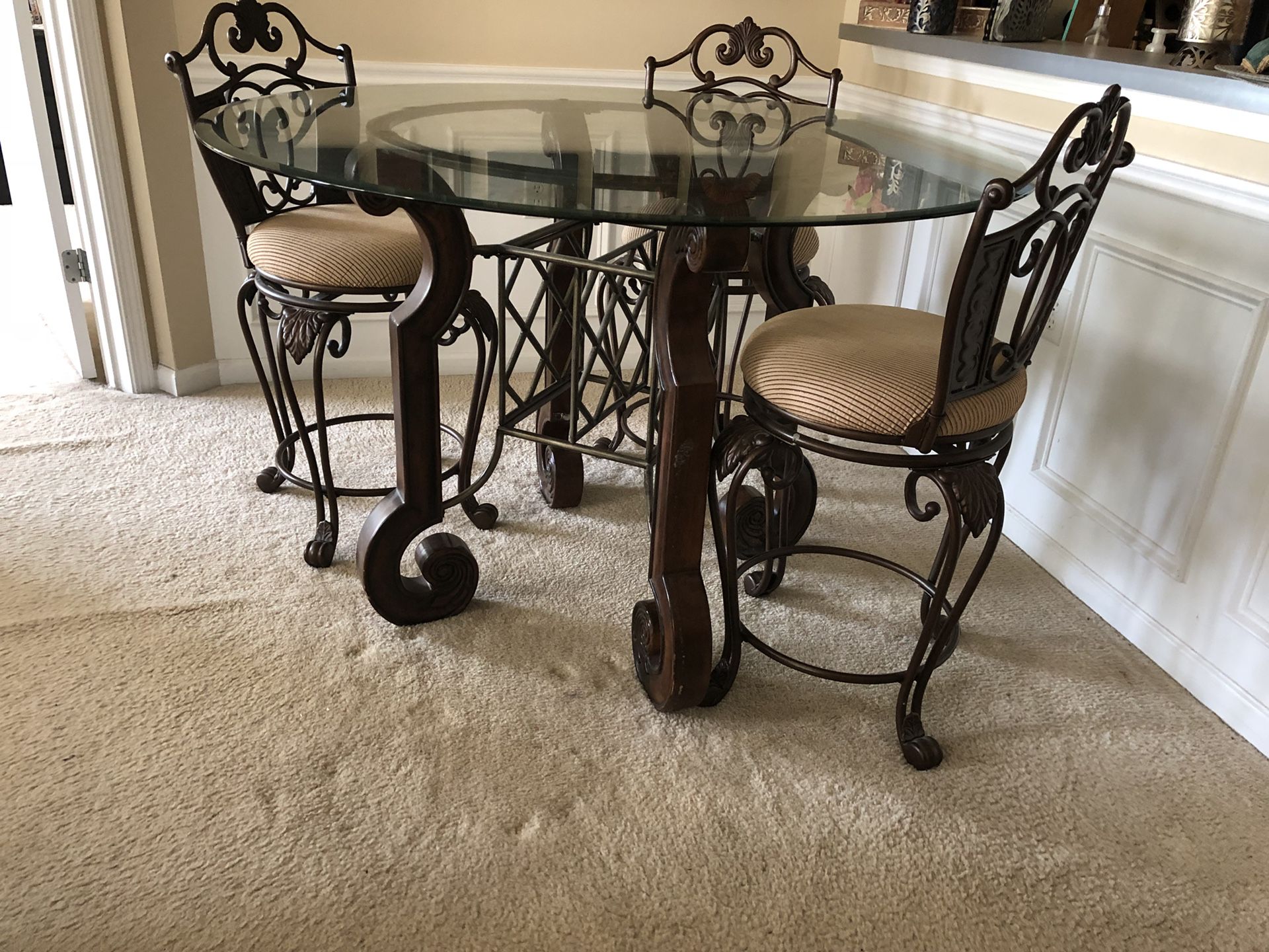 Indoor or Outdoor Dining table with glass top and four chairs