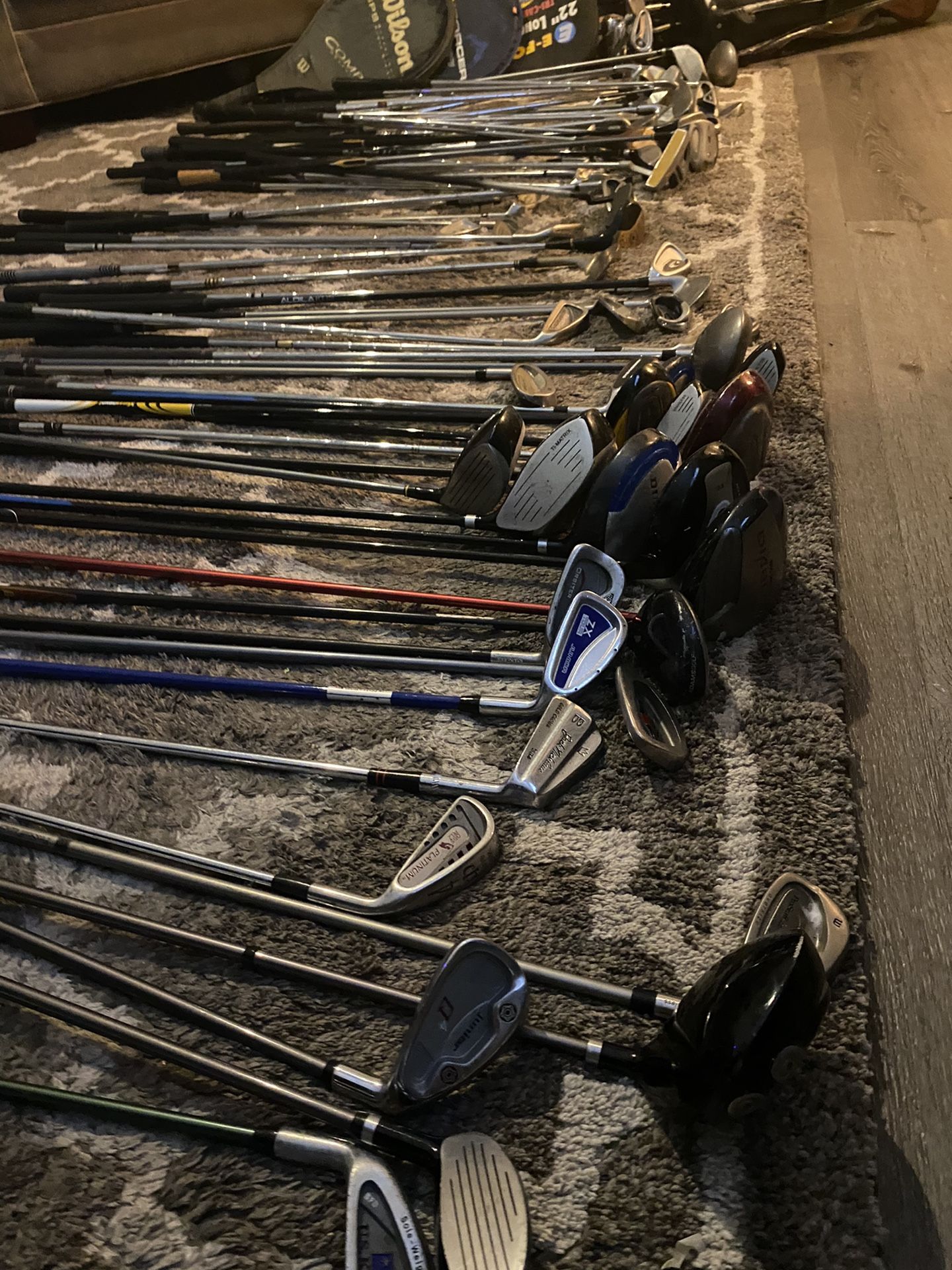 Golf Clubs Pool Sticks And A Couple Tennis Rackets