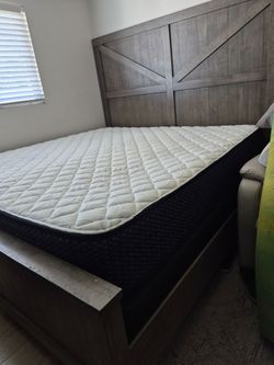 Ashley Furniture bed with a king size mattress