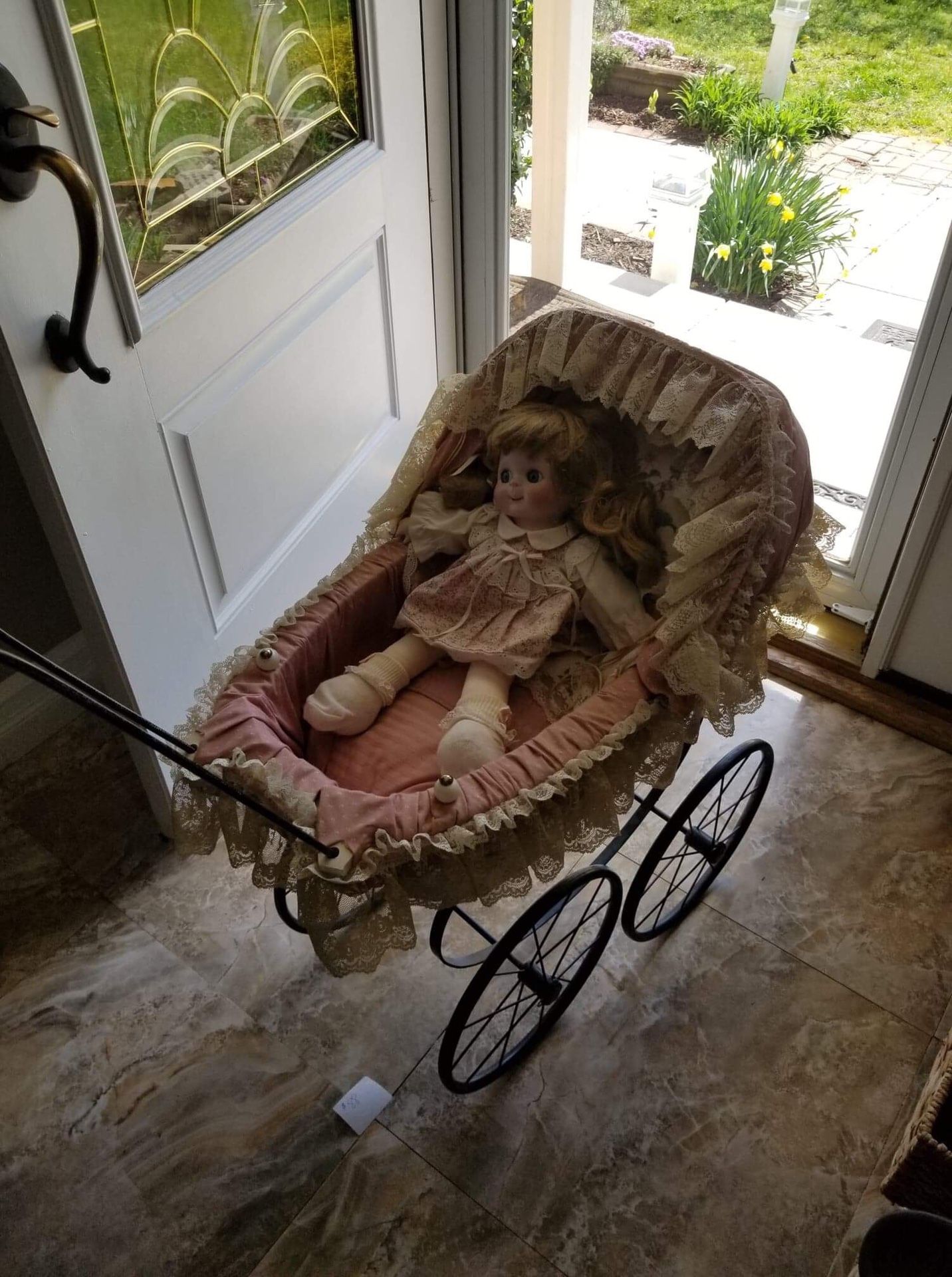 Antique baby doll carriage for display