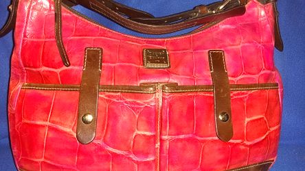 Dooney and Bourke this is a pink aligater ho Bo purse it is a large size bag