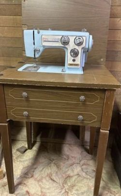 vintage blue dial and sew table sewing machine
