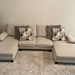 Beige couch and rug