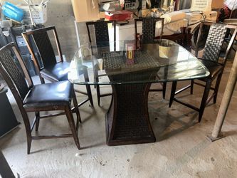 Glass top wooden dinner/patio table with 5 chairs (delivery available)