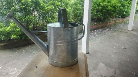Galvanized metal watering can