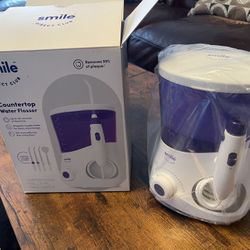 Smile Direct Club Full Size Countertop Water Flosser. New. Original price $59.99