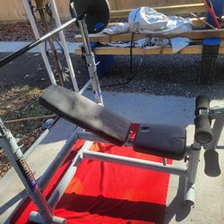 COMPETITOR. OLYMPIC WEIGHT BENCH  LEG EXTENSION  ADJUSTABLE INCLINE  AND  BAR HEIGHT.  7'  45LB BAR  WITH CLIPS.  2 GOLD'S GYM 45LB PLATES 
11525 S  H
