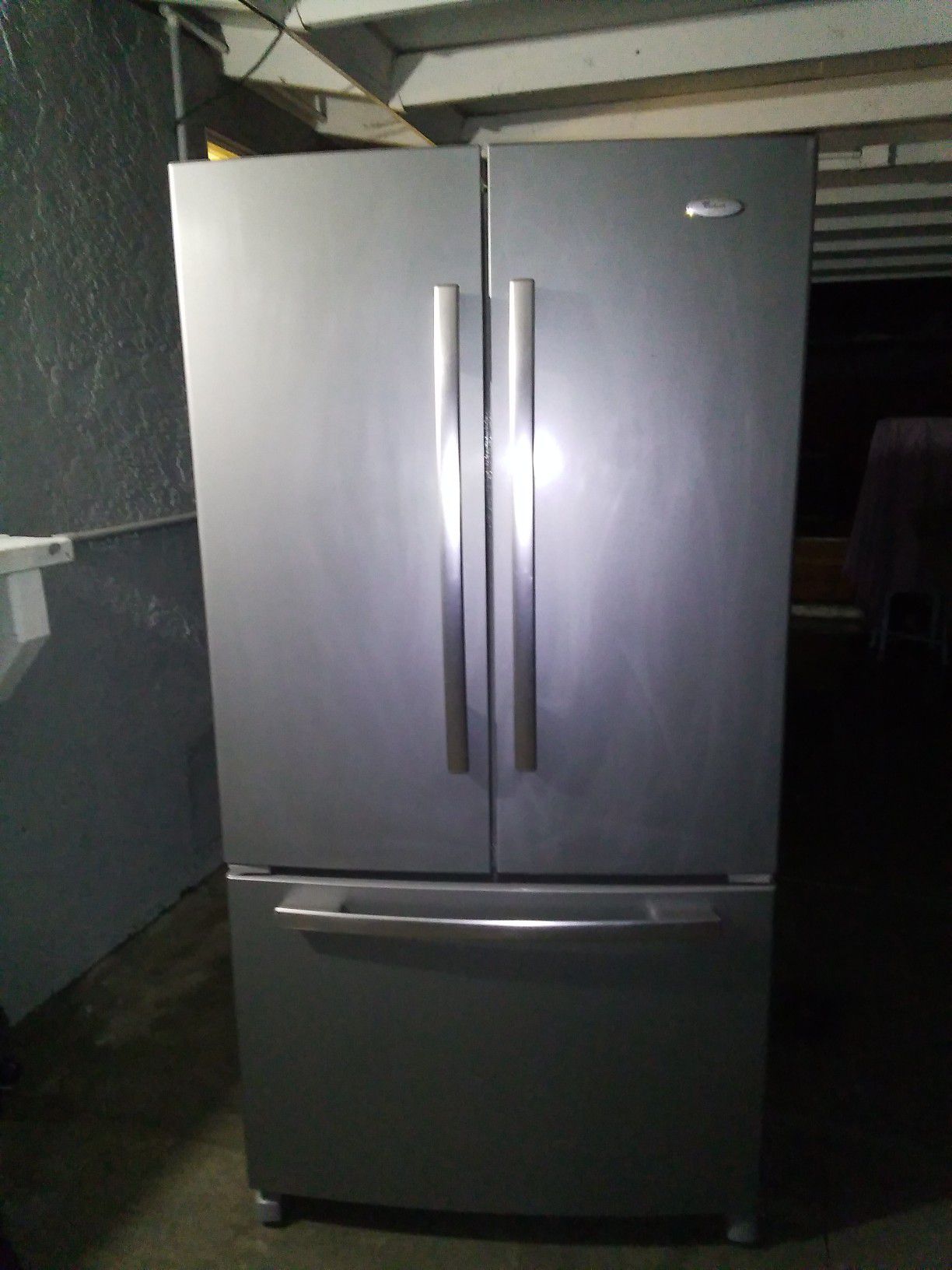 Whirlpool gold stainless steel and gray french door refrigerator / freezer. Only one month old! Works and looks like new!