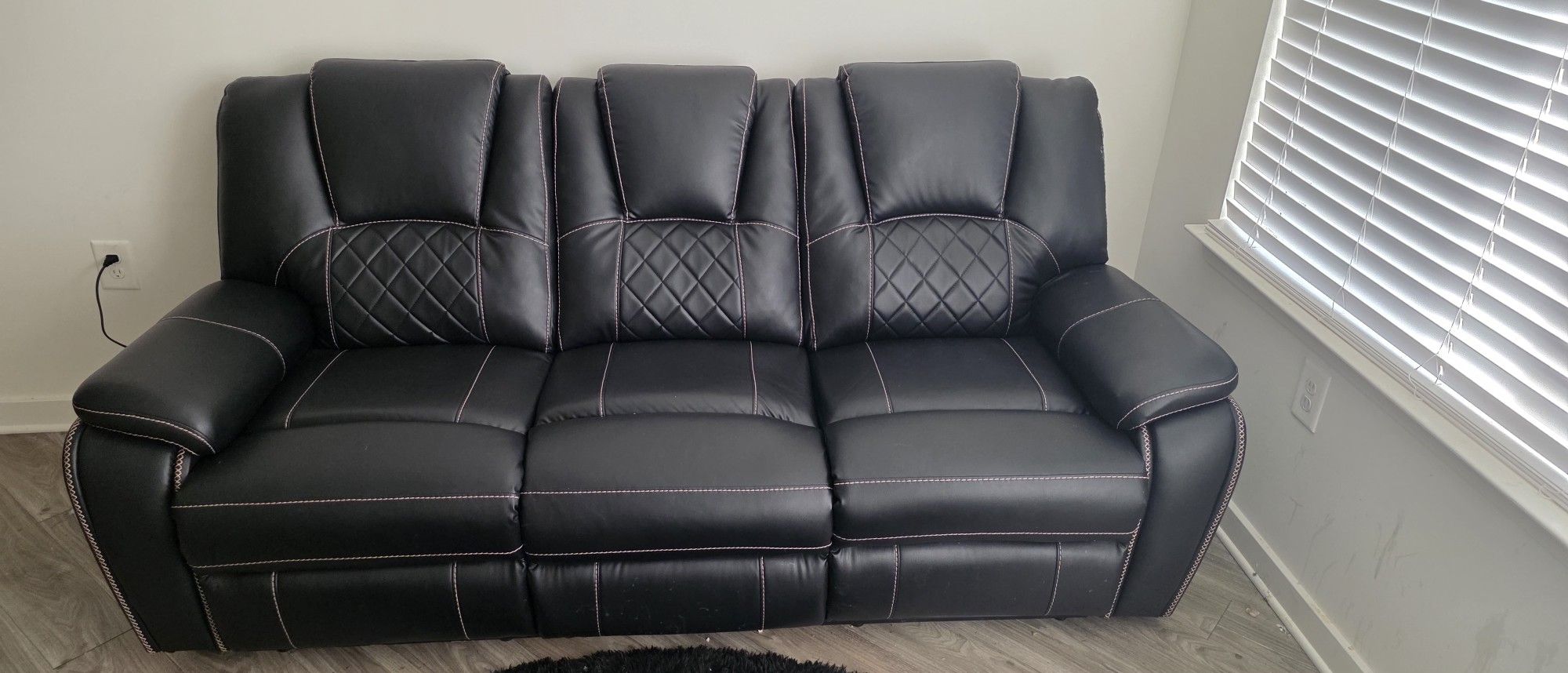 Dual Recliner, Full Size Faux Leather Couch With Stitching.