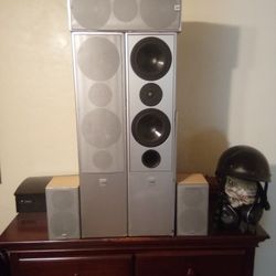 CANTON TOWERS WITH REAR AND CENTER CHANNEL SPEAKERS.