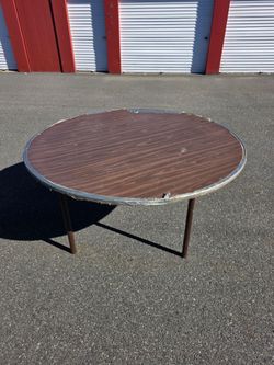 5ft Round wood table.
