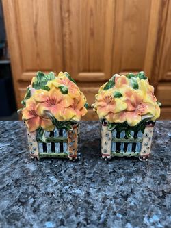 Ceramic Sakura Flower Basket  Pair of Salt and Pepper Shakers.  Preowned never used with sticker on the bottom.  Size appropriately 3 1/2 inches tall.