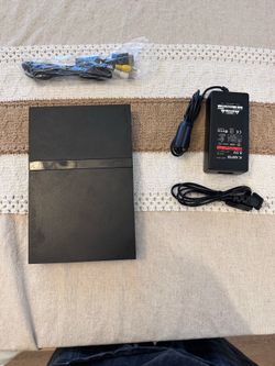 PlayStation 2 slim with cords