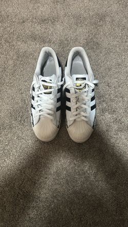 Pairs of nikes and adidas