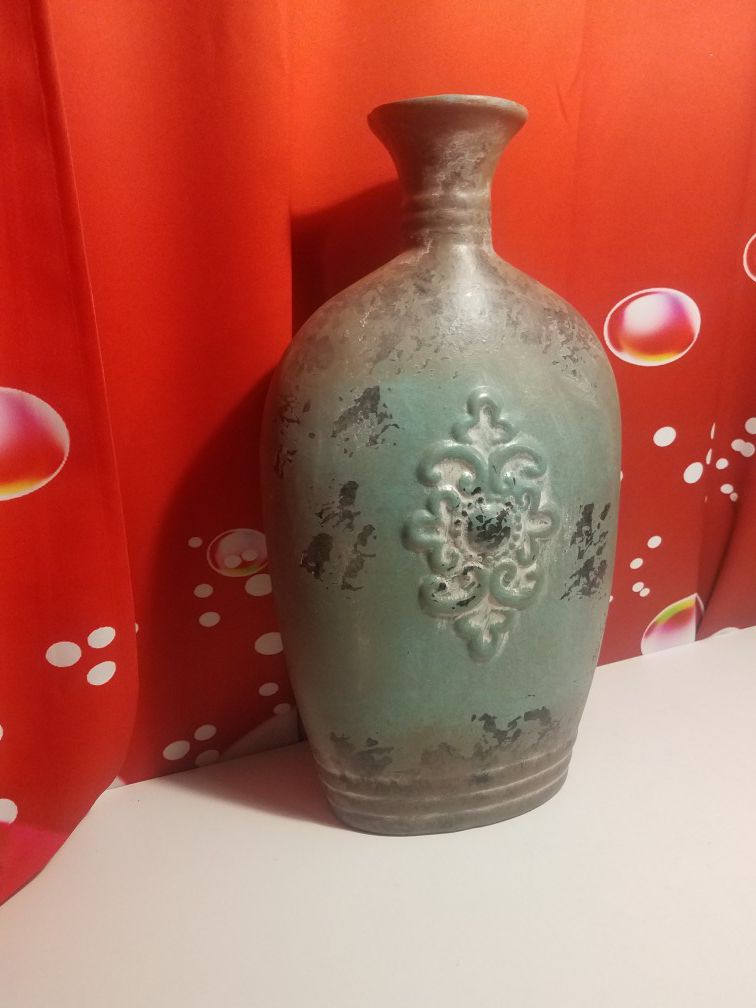 This wonderful decor from DecMode includes a 20-inch mediterranean inspired distressed verdigris and brown finish stoneware fluted vase