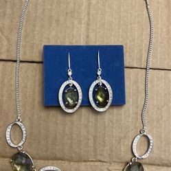  Silver toned bubble necklace with green and iridescent rhinestones and matching earrings.